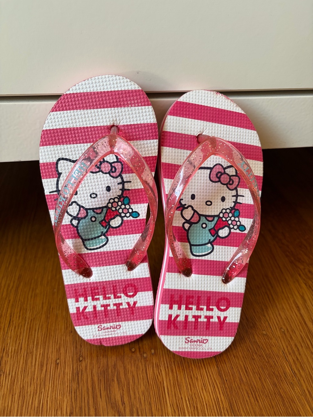 Sanrio Hello Kitty Pink and White Striped Flip Flops